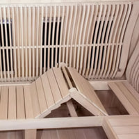 Salt Therapy Room Built for Shared Wellness, Curved Glass Design, Radiant Heat Bench, Micro-Salt Diffuser